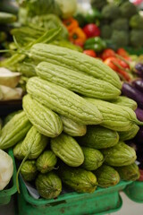 Batch of green fruits of bitter melon. Tumpukan Pare