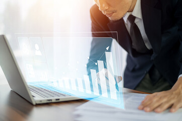Businessman trader use computer  virtual screen stock market and investment trading online