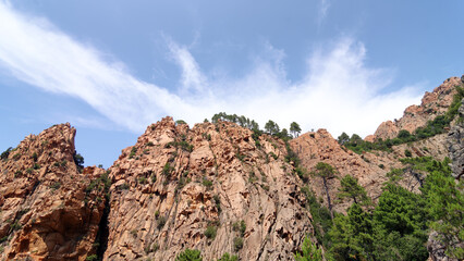 Fototapeta na wymiar Red granite rock formations between Piana village in Corsica island