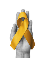Childhood cancer awareness gold ribbon isolated on white background with clipping path. Golden bow...