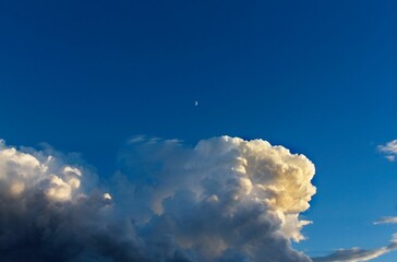 The moon with huge white clouds