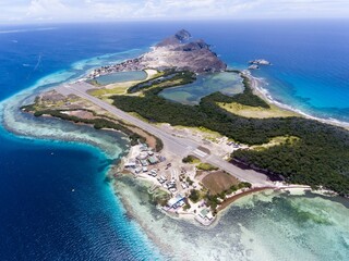 Aerial shot of Los Roques Archipelago in Venezuela surrounded with clear water