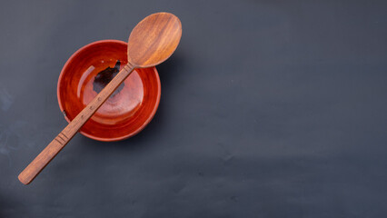 wooden bowl. wooden utensils. wooden spoon. bowl and spoon. bowl. spoon. Wooden Bowl and Spoon. Top view. Copy, empty space for text