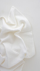 Fototapeta na wymiar white kitchen towel with texture on a light background