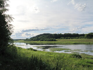 summer river in the countryside in the evening
