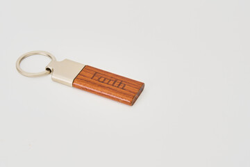 keychain with the word faith isolated 