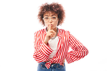 Young positive kazakh girl with afro hairstyle put finger on lips shh keep silence and secret isolated on white background