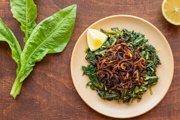 Famous Mediterranean dish with chicory leaves. Lebanon Hindbeh Bi Zeit (chicory with olive oil)...