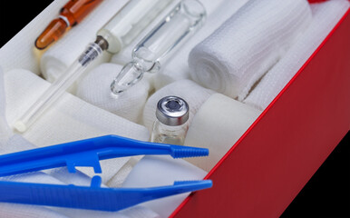 First aid kit. Bandages and a syringe with painkillers.