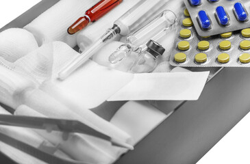 First aid kit. Bandages and a syringe with painkillers.