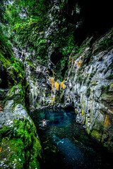 A swimmer in a waterpond of Langevin river in Reunion Island