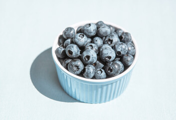 Blue blueberry on the table, card with organic fresh berries
