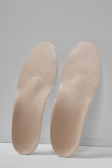 Insoles isolated on a white background. Medical orthopedic insoles. Foot care. Insole cutaway layers. Treatment and prevention of flat feet and foot diseases. Inner soles of shoes.