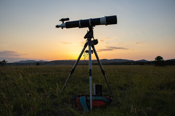 Astronomical telescope and equipment for observing stars, Milky way and planets in nature, far from...