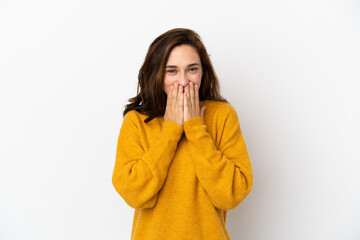 Young caucasian woman isolated on white background happy and smiling covering mouth with hands