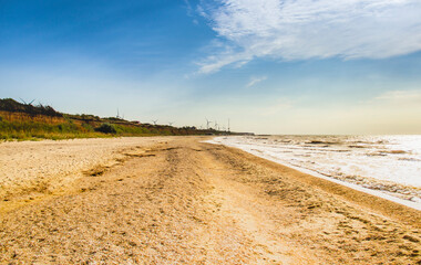 Fototapeta na wymiar sea landscape and windmills farm on background, Azov sea, Ukraine