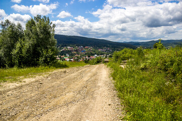 Fototapeta na wymiar a rural road in the Carpathian village, Skole Beskids National Nature Park, Ukraine