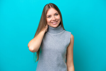 Young Lithuanian woman isolated on blue background laughing