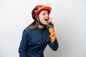 Young cyclist Lithuanian woman isolated on white background shouting with mouth wide open to the side