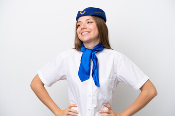 Airplane Lithuanian woman stewardess isolated on white background posing with arms at hip and smiling