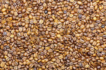 Coffee beans. Background of roasted fresh brown coffee beans. Perfect for a cool wallpaper. Banner for cafe. Template for cafe menu.  Copy space. Beautiful closeup shot of fresh black coffee beans