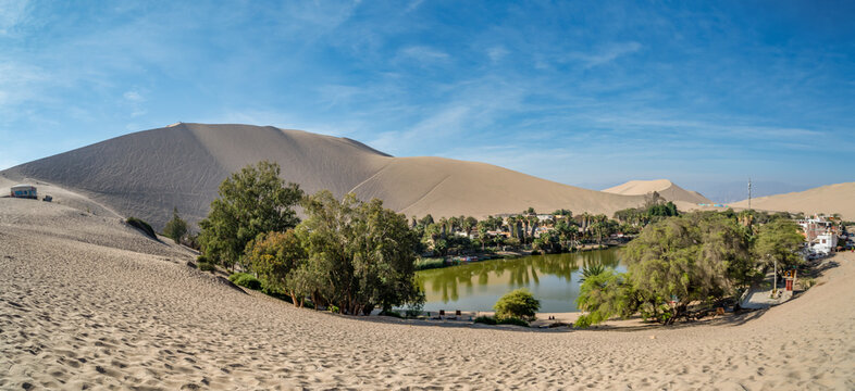 Huacachina is a desert oasis and a small village just west of the city of Ica in southwestern Peru