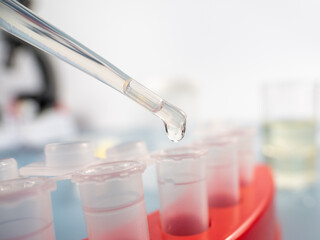 Analytical chemistry - a sample is pipetted into a test tube.