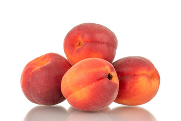 Fototapeta na wymiar Several ripe red apricots, close-up, isolated on a white background.