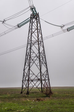 Metal electrical cable poles used in the field during rainy weather.