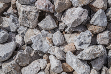 Stones cobblestones under the railway.Lime stone close-up as a background
