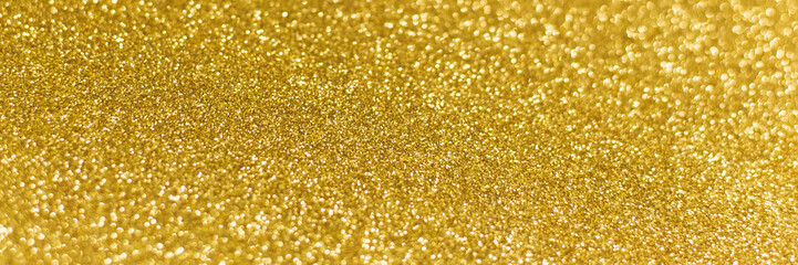 Golden shiny background. gold glitter texture christmas abstract background. Web banner