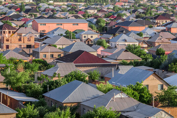 Roofs of houses of the private sector in the city. Urban landscape.