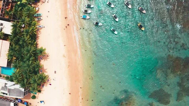 Birds eye view of the beach and boats in costal area in Sri Lanka South 