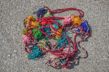 Multi-colored threads and fringe made of wool. Ornament for a yurt.