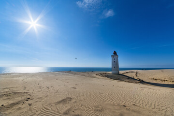 Fototapeta na wymiar The iconic lighthouse Rubjerg Knude Fyr in the dunes of northern Denmark on a summer day