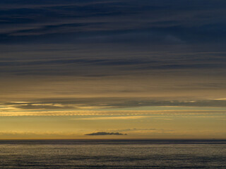 Gentle sunset. North Devon coast with horizon, sea and sky.