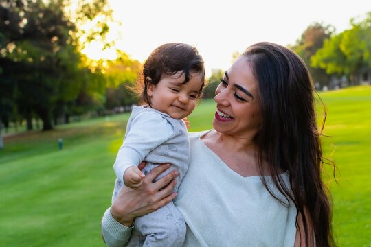 Hispanic Mom And Baby Outdoors