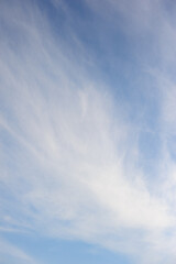 Natural background of blue sky with white cumulus clouds