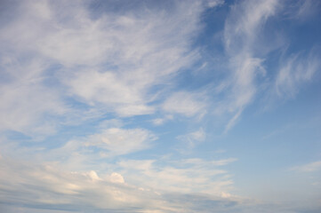 Natural background of blue sky with white cumulus clouds