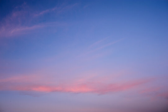 Scenic view of orange clouds on blue sunset sky
