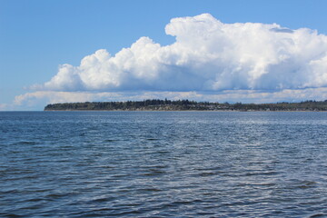 Tides move in Birch Bay under spring clouds