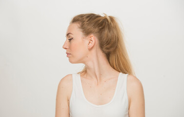 Portrait  of a beautiful young women, dressed white T-shirt , isolated on white.emotional portrait of a young Ukrainian girl