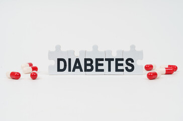 On a white surface are tablets and puzzles with the inscription - DIABETES