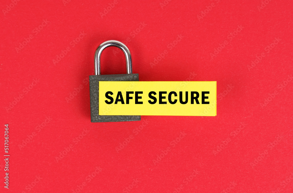 Poster On the red surface there is a lock with a sticker with the inscription - Safe Secure