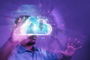 Concept Man wearing VR glasses and accessing Cloud Technology Internet Network data system and database via technology

