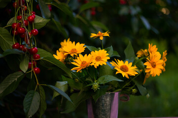 bouquet of yellow flowers and cherries
