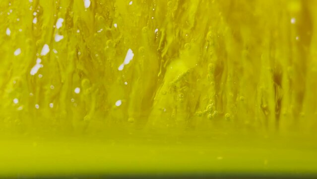 Melting ice, yellow dye mixed with water. Oxygen balls.