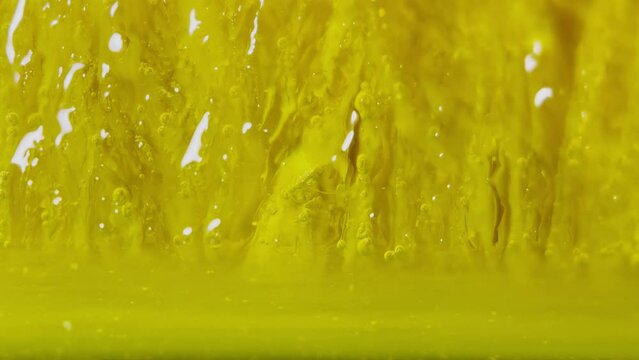Melting ice, yellow dye mixed with water. Oxygen balls.