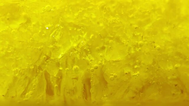 Melting ice, yellow dye mixed with water. Oxygen balls.