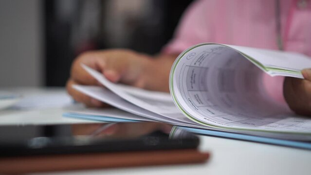 Document in Business people manager checking finance report and signing documents reports papers on paper files in meeting room, checking data contract partner deal workplace office management